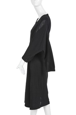 Lot 60 - An important Comme des Garçons distressed black wool dress, probably ‘Holes’ collection, Autumn-Winter 1982-83