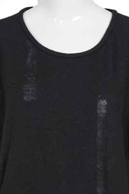 Lot 60 - An important Comme des Garçons distressed black wool dress, probably ‘Holes’ collection, Autumn-Winter 1982-83