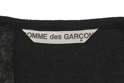 Lot 60 - An important Comme des Garçons distressed black wool dress, probably ‘Holes’ collection, Autumn-Winter 1982-83