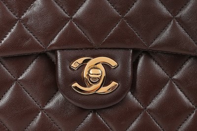 Lot 24 - A Chanel quilted brown leather bag, 1990s,...