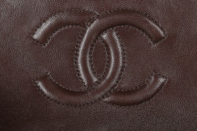 Lot 24 - A Chanel quilted brown leather bag, 1990s,...