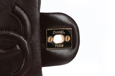 Lot 24 - A Chanel quilted brown leather bag, 1990s,...