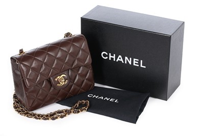 Lot 24 - A Chanel quilted brown leather bag, 1990s,...