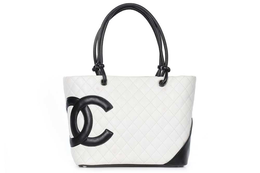 Lot 1 - A Chanel quilted white leather shopper, 1990s,...