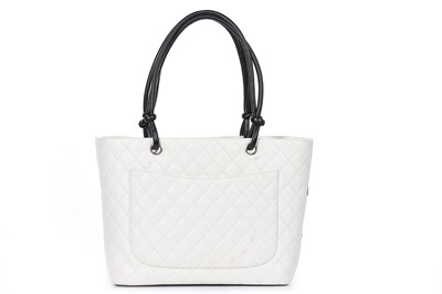 Lot 1 - A Chanel quilted white leather shopper, 1990s,...