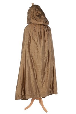 Lot 133 - A rare brown silk padded and hooded cape, late...