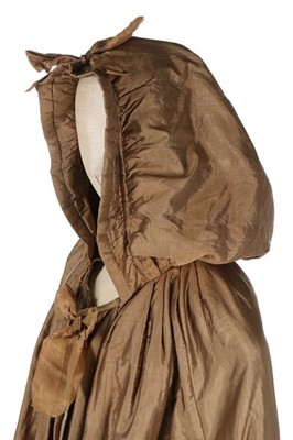 Lot 133 - A rare brown silk padded and hooded cape, late...