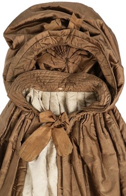 Lot 133 - A rare brown silk padded and hooded cape, late...