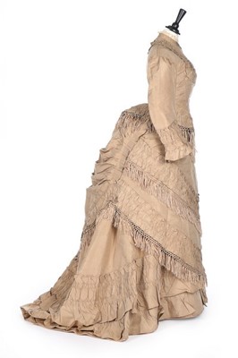 Lot 142 - A taupe taffeta gown with day and evening...