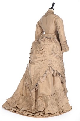 Lot 142 - A taupe taffeta gown with day and evening...