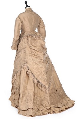 Lot 142 - A taupe taffeta gown with day and evening...