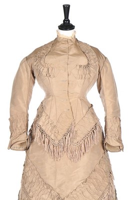 Lot 142 - A taupe taffeta gown with day and evening...