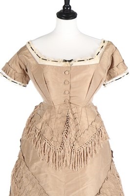 Lot 142 - A taupe taffeta gown with day and evening...