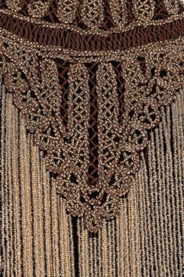 Lot 139 - A beaded brown velvet 'visite', 1880s, the...