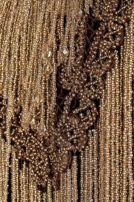 Lot 139 - A beaded brown velvet 'visite', 1880s, the...