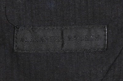 Lot 316 - An Alexander McQueen men's duffle coat and sweater ensemble, 2010-11