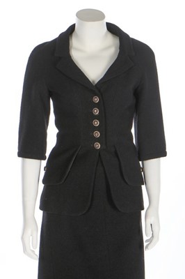 Lot 41 - A Chanel black bouclé wool ensemble, 2007,...