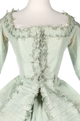 Lot 102 - A peppermint-green silk 'Circassienne' robe,...