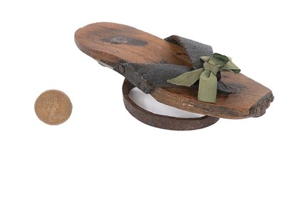 Lot 132 - A rare pair of girl's wooden pattens, second...