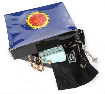 Lot 3 - A Gianni Versace pale-blue faux crocodile...