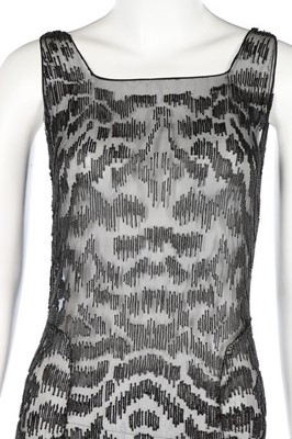 Lot 191 - A black bugle beaded chiffon evening dress,...