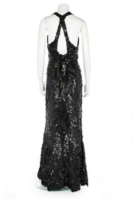 Lot 188 - An ornately sequinned black evening gown,...