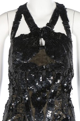 Lot 188 - An ornately sequinned black evening gown,...