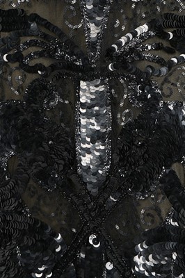 Lot 188 - An ornately sequinned black evening gown,...