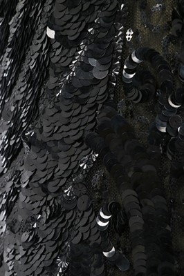 Lot 188 - An ornately sequinned black evening gown,...