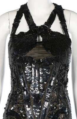 Lot 188 - An ornately sequinned black evening gown,...