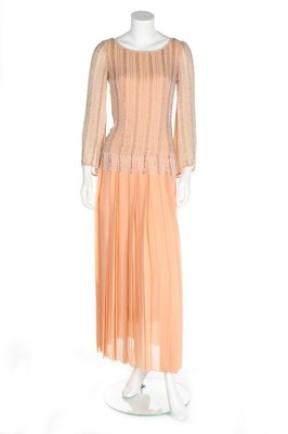 Lot 204 - A Chanel couture beaded pale peach chiffon...