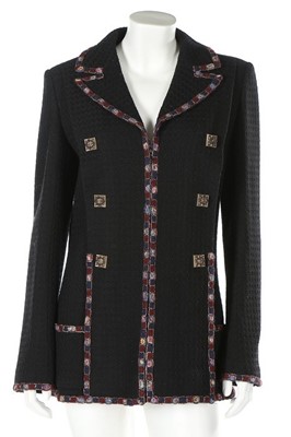 Lot 40 - A Chanel black tweed jacket, 2000s, labelled...