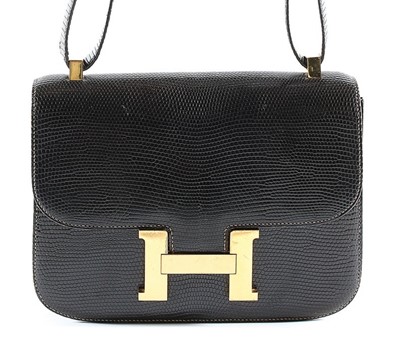 Lot 2 - An Hermès dark brown lizard 'Constance' bag,...