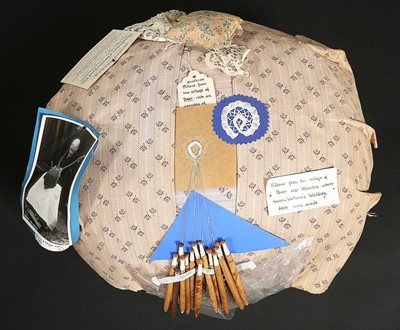 Lot 452 - A Honiton bobbin pillow and assorted bobbins,...