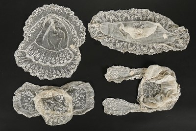 Lot 467 - A group of lace and whiteworked bonnets,...