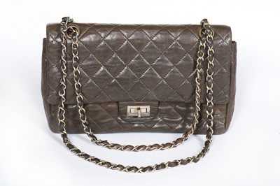 Lot 7 - A Chanel quilted brown leather flap bag, 1960s,...