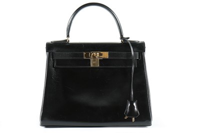 Lot 8 - An Hermès black leather Kelly bag, 1987,...