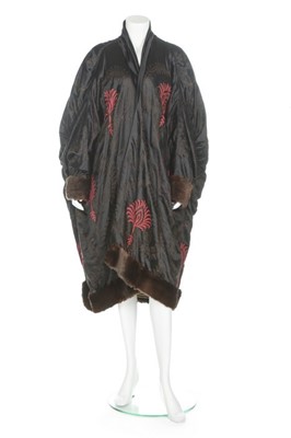 Lot 59 - An orientalist embroidered black satin opera...