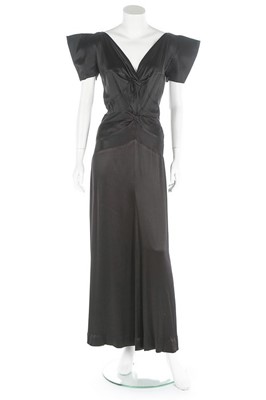 Lot 95 - A Paquin couture bias cut black satin evening...