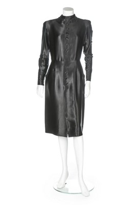 Lot 100 - A Jean Patou couture black satin trapunto...