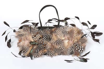 Lot 5 - An unusual Cartier suede and feather evening...