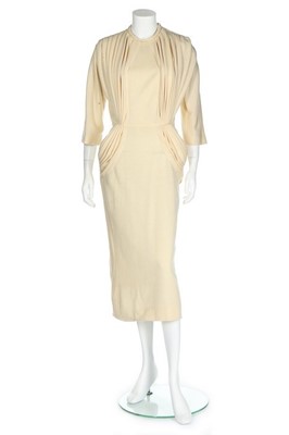 Lot 120 - A Madame Grès couture knitted cream wool...