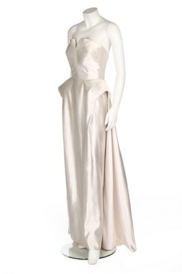Lot 103 - A Maggy Rouff couture ice-white satin sheath,...
