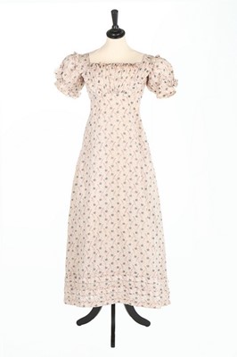Lot 40 - A printed cotton day dress, circa 1825, roller-...