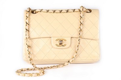 Lot 10 - A Chanel beige quilted leather 2.55 bag, 1980s,...