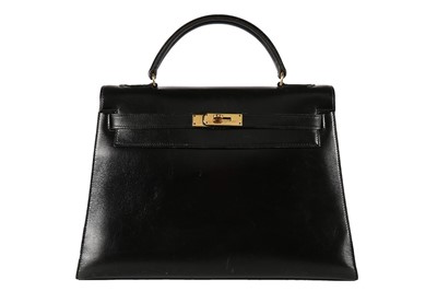 Lot 7 - An Hermès black leather Kelly bag, 1960s,...