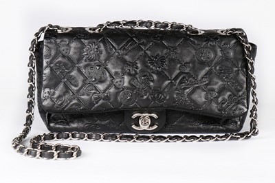 Lot 6 - A Chanel black embossed leather handbag,...