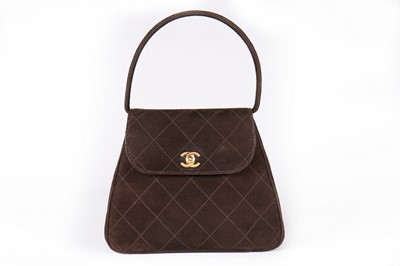 Lot 5 - A Chanel dark brown suede evening bag, 1990s,...