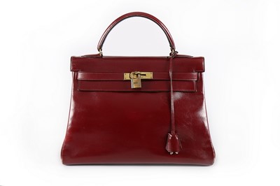 Lot 19 - An Hermès ox-blood leather Kelly bag, 1960s,...