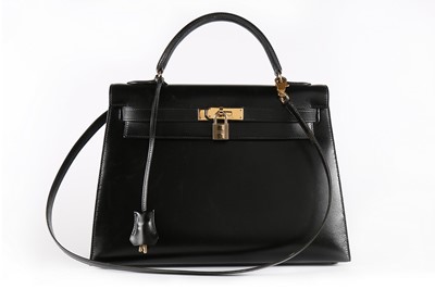 Lot 20 - A good Hermès black leather Kelly bag, 1992,...